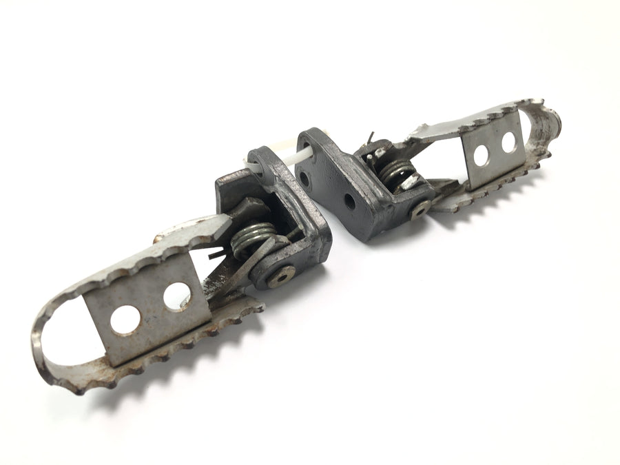 Husqvarna TE 610 E Dual H7 [1999] - Driver footrests with spring mechanism set pair